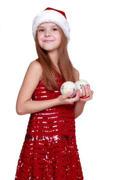 小女孩在圣诞老人的帽子上的节日主题 — 图库照片