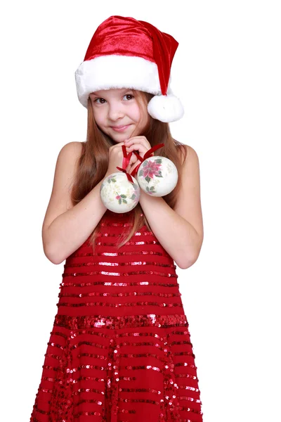 学龄前的女孩手里拿着的圣诞装饰 — 图库照片