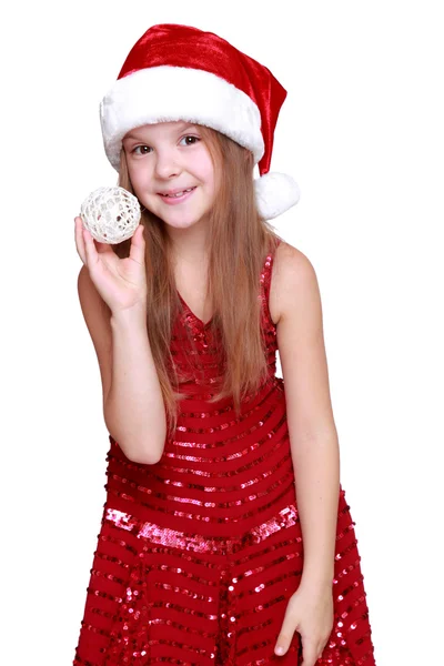 Девушка с рождественскими украшениями в руках — стоковое фото