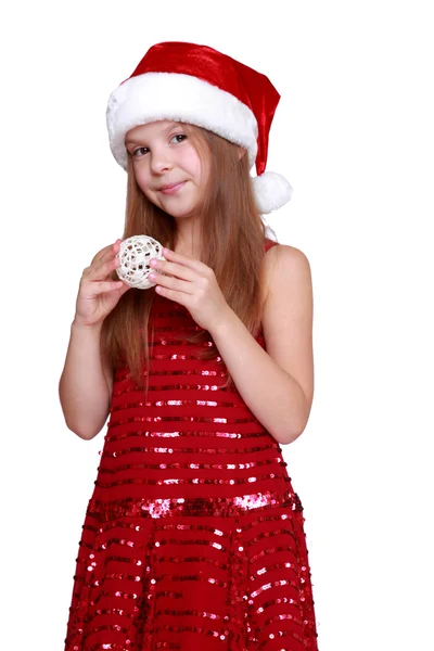 Chica sosteniendo la decoración de Navidad en las manos — Foto de Stock