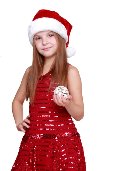 Chica sosteniendo la decoración de Navidad en las manos — Foto de Stock