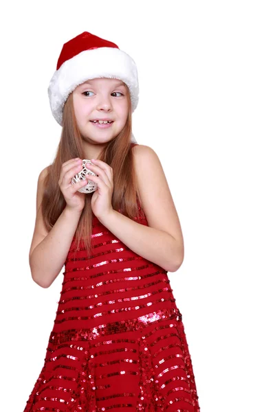 Chica sosteniendo la decoración de Navidad en las manos —  Fotos de Stock