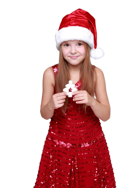 Girl dressed in a red dress and red santa hat — Stock Photo, Image