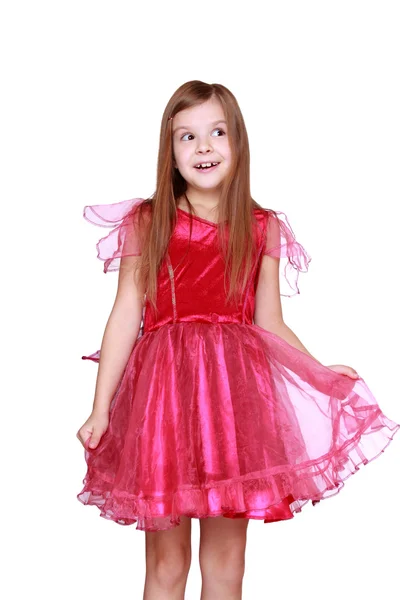 Menina mostrando seu traje de carnaval rosa — Fotografia de Stock