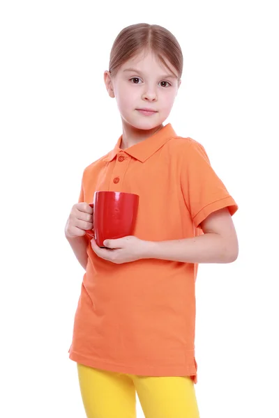 Jolie petite fille avec tasse de thé — Photo