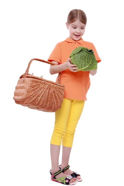 Little girl holding a head of cabbage — Stock Photo, Image
