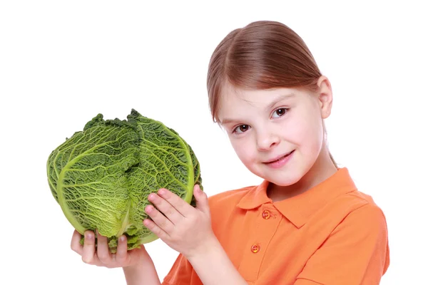 Little girl holding a head of cabbage — Stock Photo, Image
