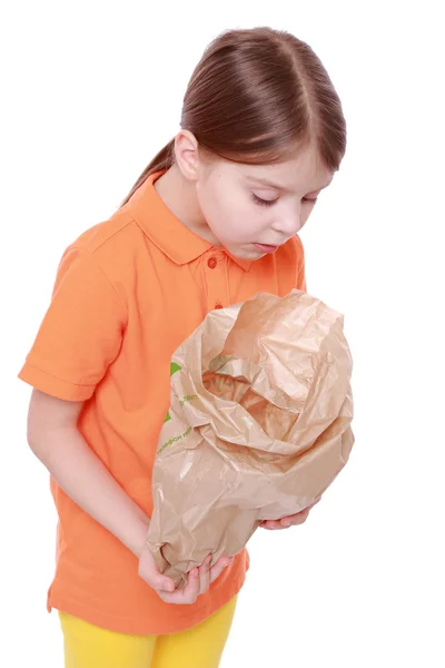 Menina com saco de papel — Fotografia de Stock