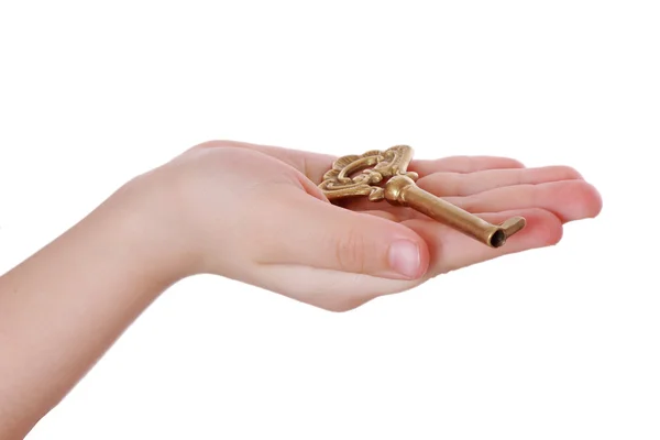 Little girl hand with an old key — Stock Photo, Image