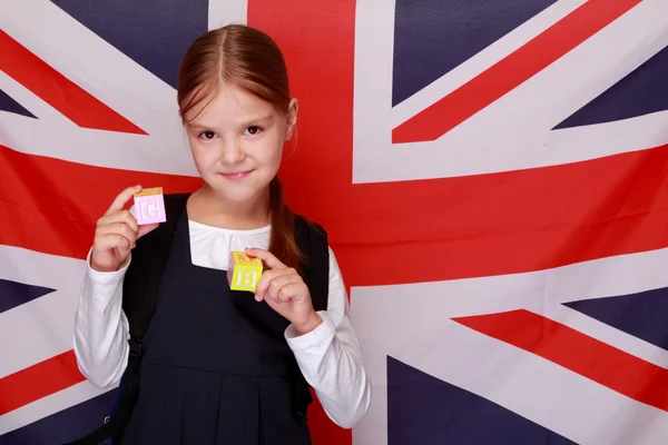 Liseli kız arka planda İngiltere bayrağı — Stok fotoğraf