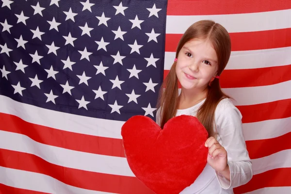 Chica en el fondo de la bandera americana Fotos de stock libres de derechos