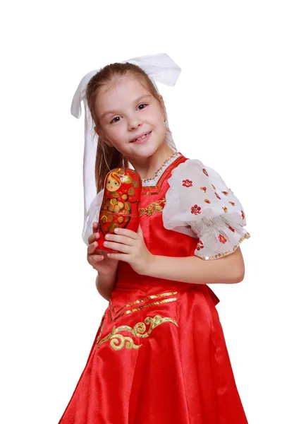 Girl holding doll in tradition style — Stock Photo, Image