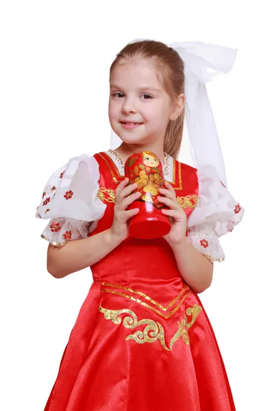 Girl holding doll in tradition style — Stock Photo, Image