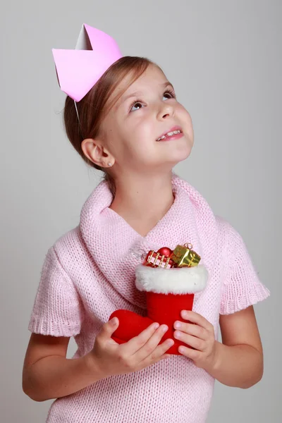 Girl holding Christmas decoration — Stock Photo, Image