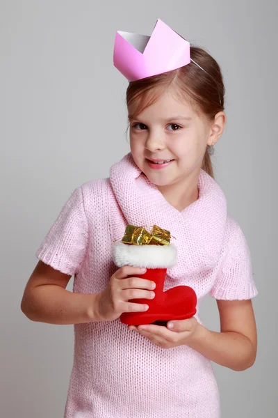 Girl holding Christmas decoration — Stock Photo, Image