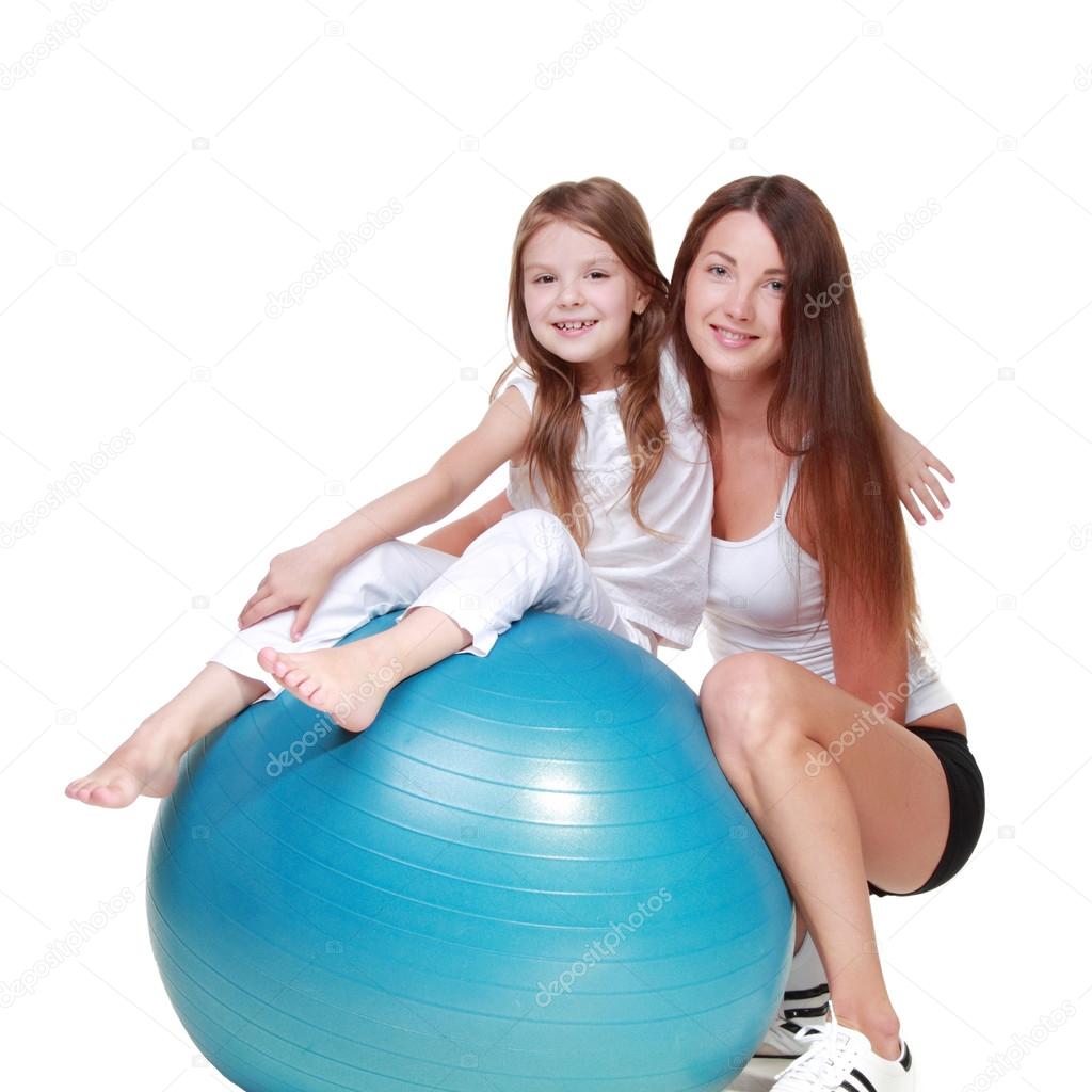 Mother with her daughter play sports