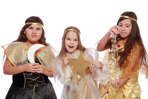 Meisjes in fairy jurken holding een gouden maan en sterren — Stockfoto