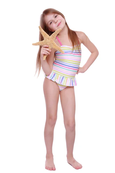Mädchen mit einem Seestern in der Hand — Stockfoto
