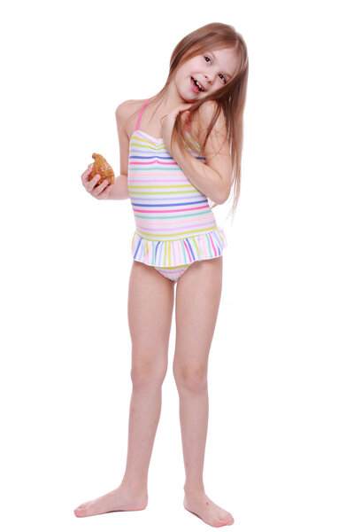 Girl in swimsuit with shell