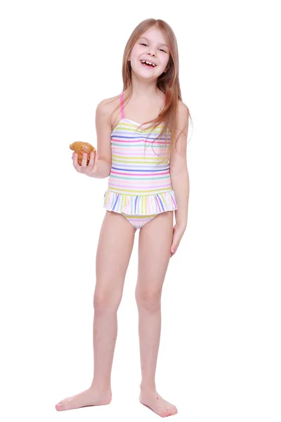 Mädchen im Badeanzug mit Muschel — Stockfoto