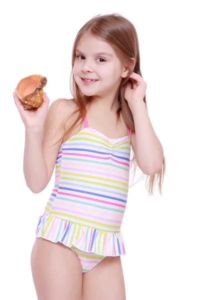 Menina em maiô com concha — Fotografia de Stock