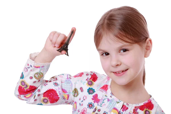 Girl holding Eiffel Tower — Stock Photo, Image