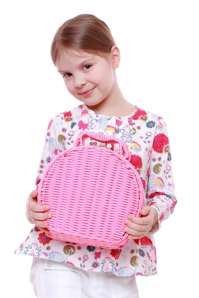 Girl with a pink basket — Stock Photo, Image