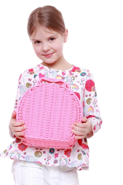 Girl with a pink basket — Stock Photo, Image