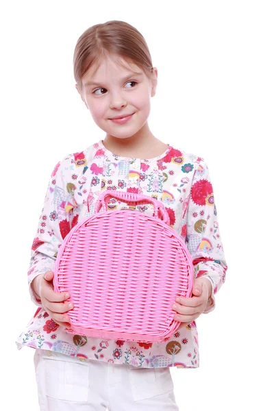 Meisje met een roze mand — Stockfoto