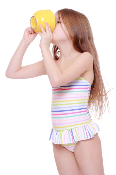 Little girl with big yellow cup — Stock Photo, Image