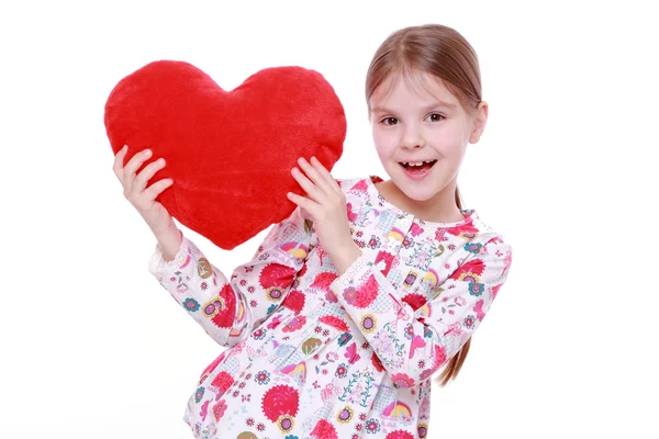 Young girl with huge red heart — Stock Photo, Image