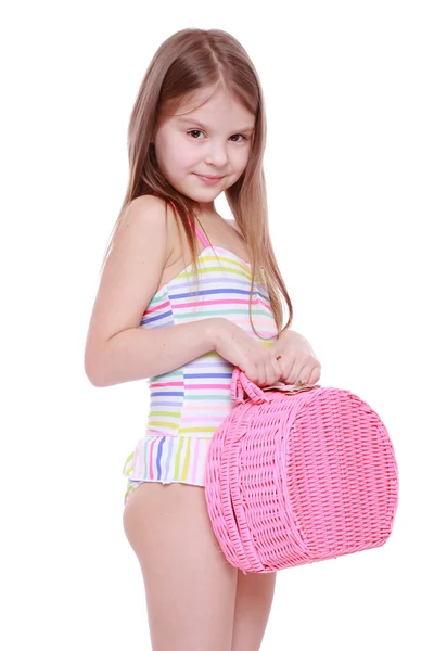 Little girl in swimsuit with basket — Stock Photo, Image