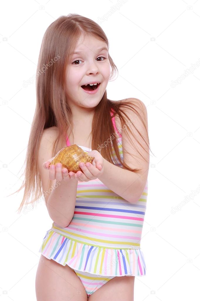 Girl in swimsuit with shell Stock Photo by ©Mari1Photo 40256093