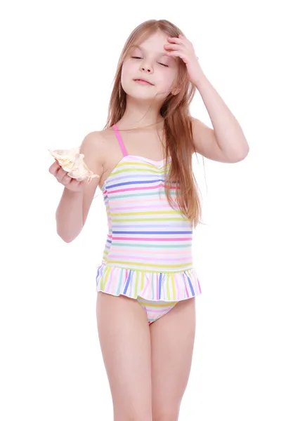 Girl in swimsuit with shell — Stock Photo, Image