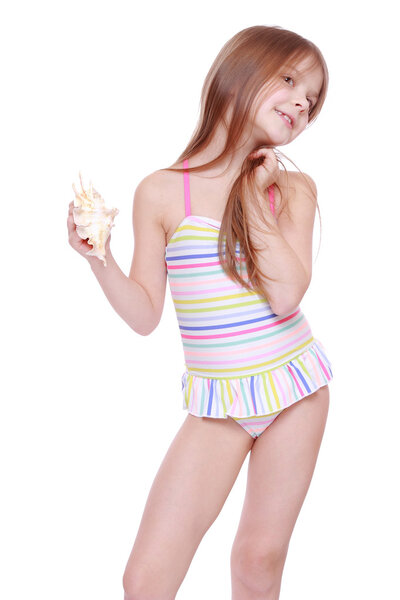Girl in swimsuit with shell