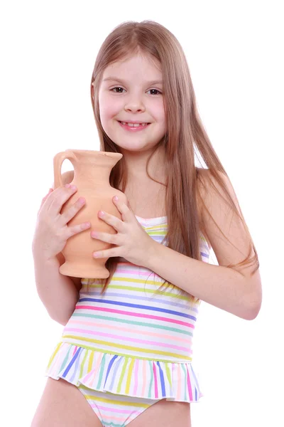 Menina em maiô com um jarro de barro — Fotografia de Stock