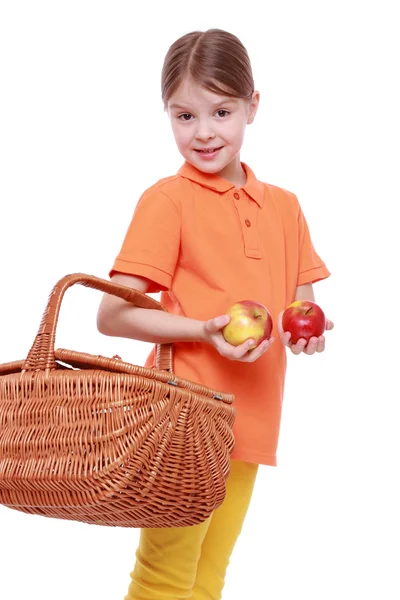 Girl with apples and basket — Stock Photo, Image