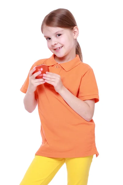 Girl holding tomato — Stock Photo, Image
