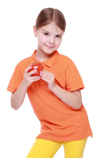 Girl holding tomato — Stock Photo, Image