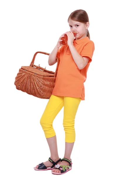 Little girl drinking tomato juice — Stock Photo, Image