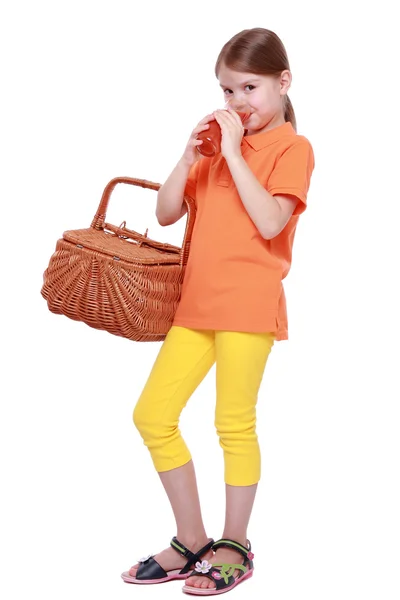 Little girl drinking tomato juice — Stock Photo, Image