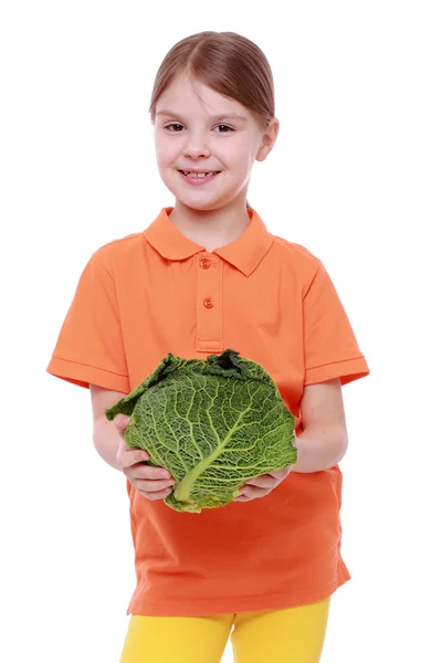 Girl holding cabbage — Stock Photo, Image