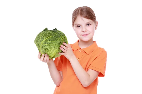 Girl holding cabbage — Stock Photo, Image