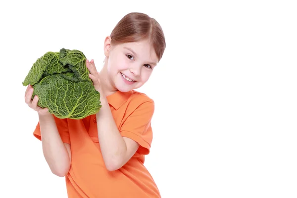 Girl holding cabbage — Stock Photo, Image