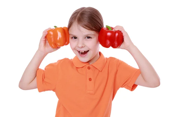 Girl holding sweet pepper — Stock Photo, Image
