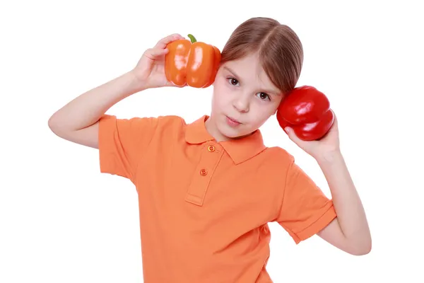 Girl holding sweet pepper — Stock Photo, Image