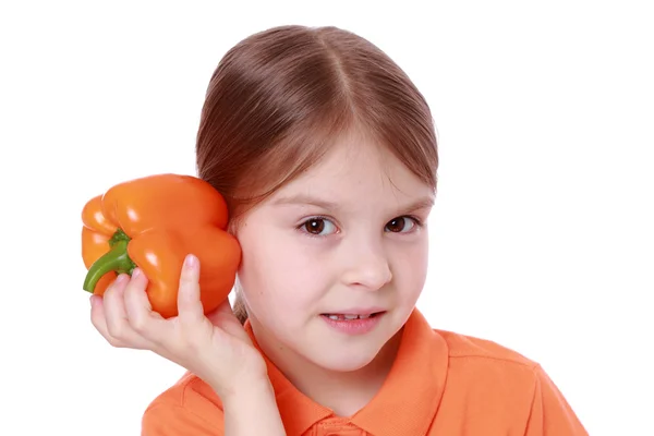 Girl holding sweet pepper — Stock Photo, Image
