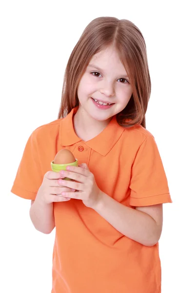 Menina segurando um ovo — Fotografia de Stock