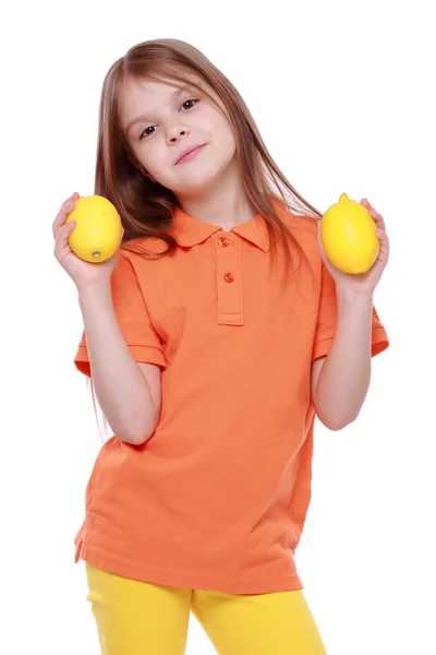 Girl with lemons — Stock Photo, Image