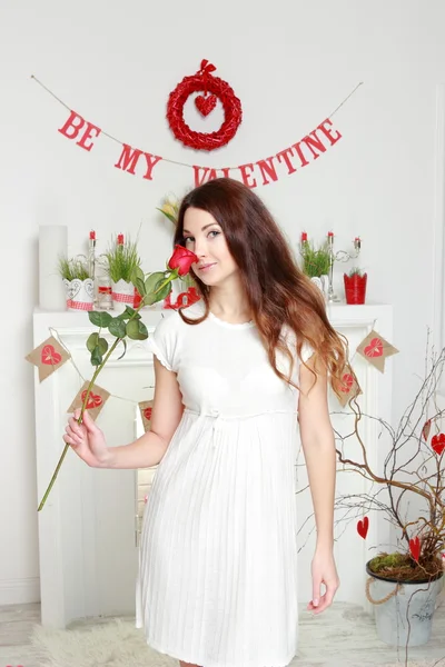 Girl holding red rose — Stock Photo, Image